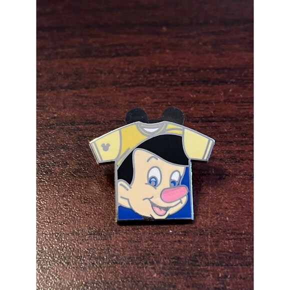 Disney 2011 Pinocchio T-Shirt Collection Hidden Mickey Trading Pin 85643 - Picture 1 of 3